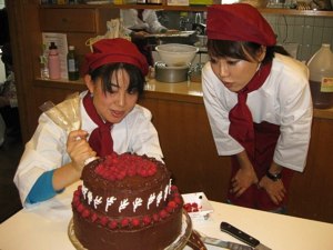 Finishing touches to the German Chocolate Cake -- JLBA Raw Food Patisserie Level 1, Tokyo, January 2011.
